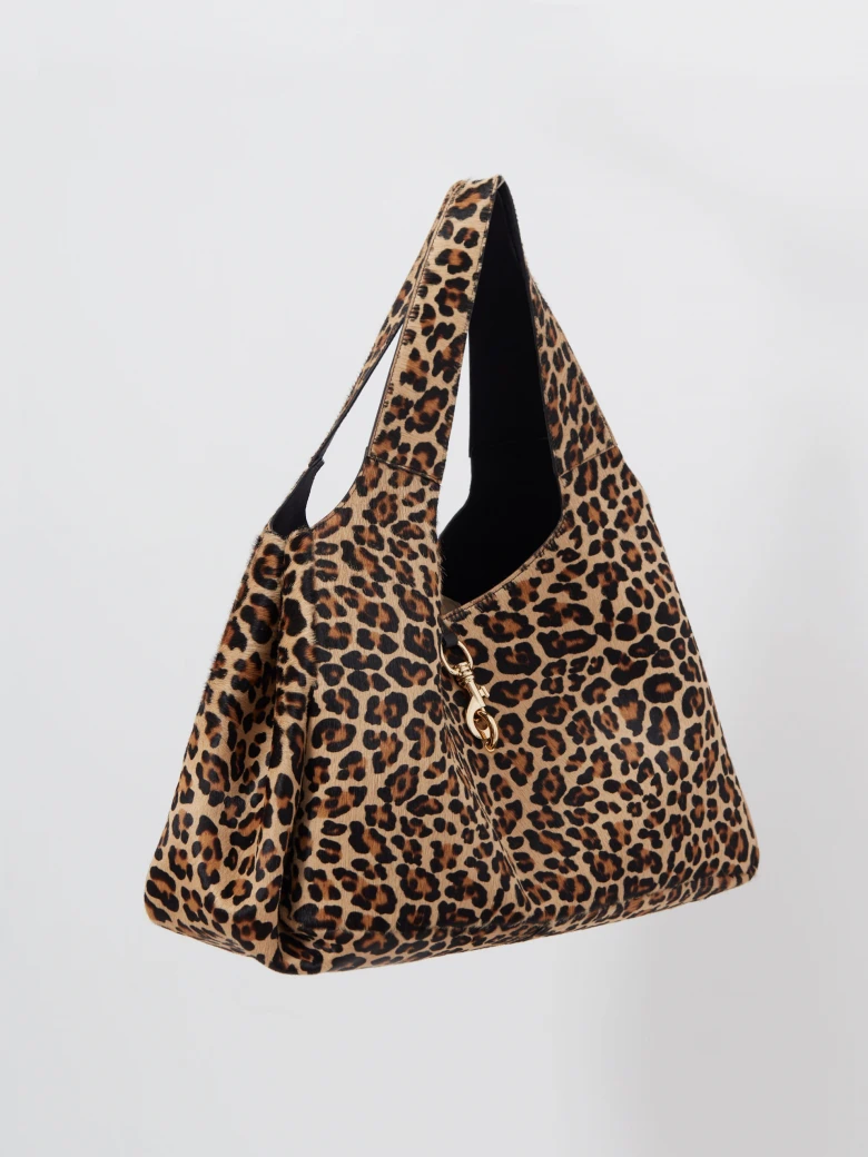 Leather handbag with a leopard print and fur texture