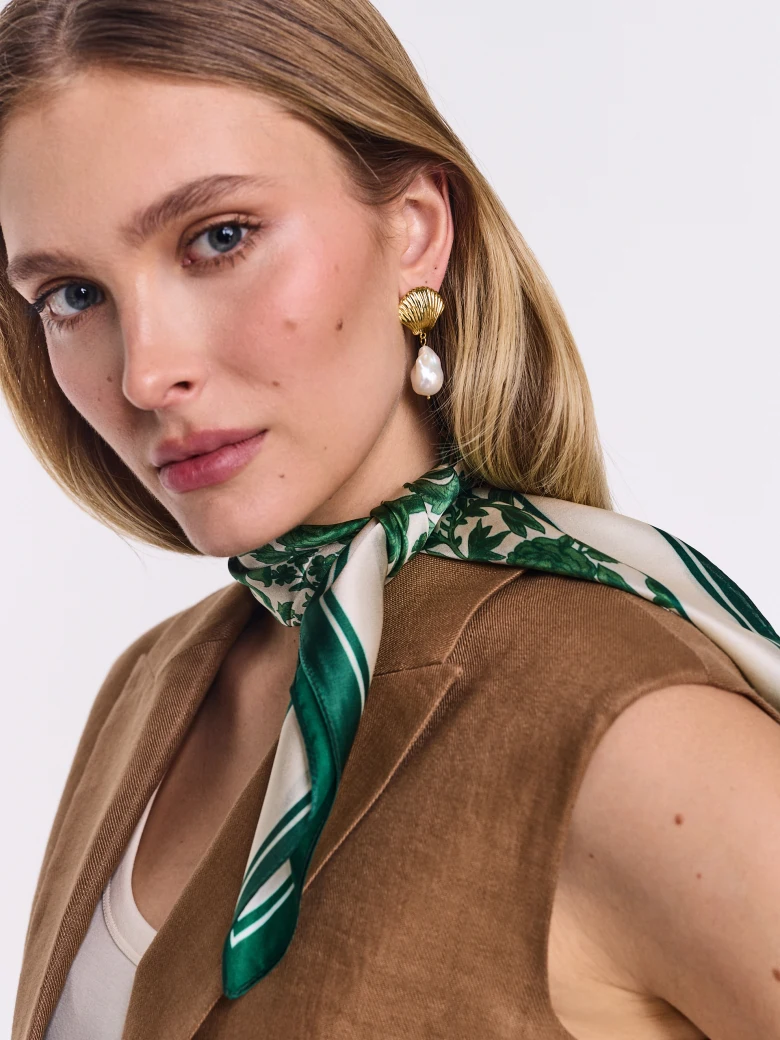 An elegant silk blouse with a floral print