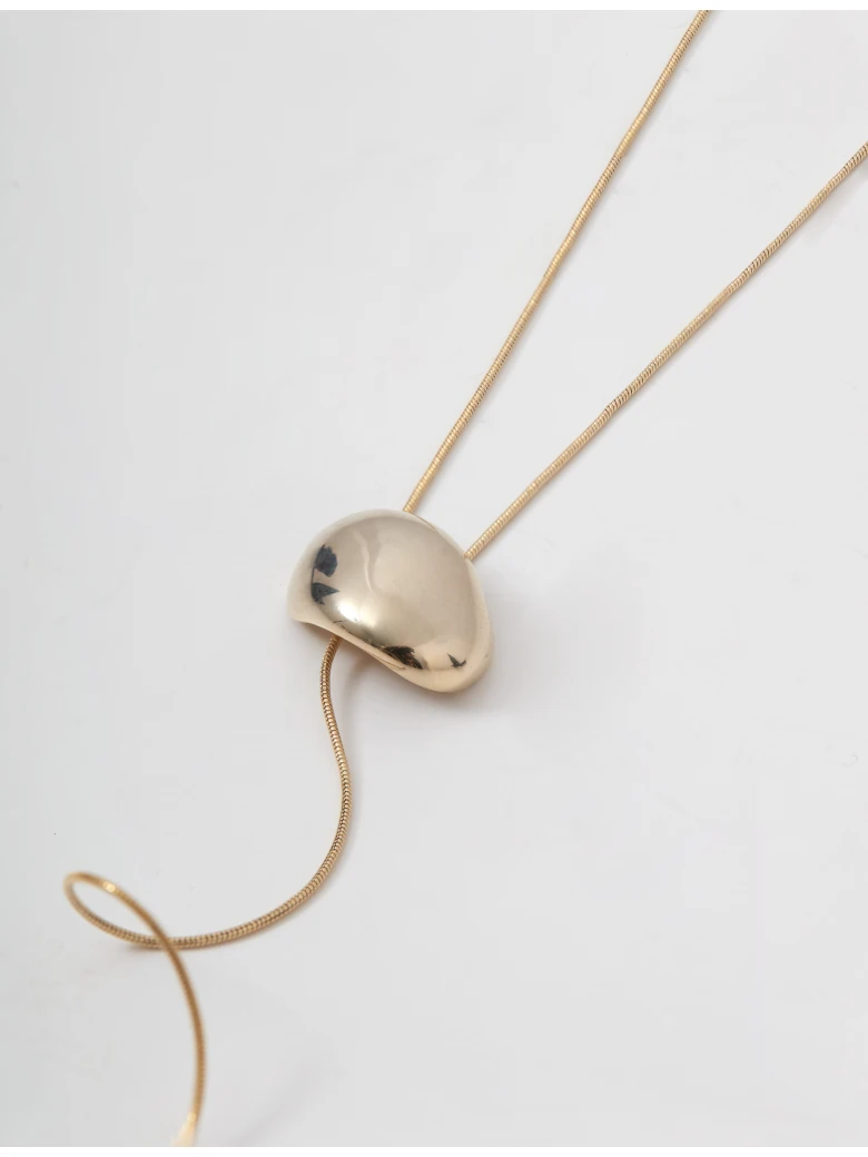 A gold-colored necklace with a pendant and a clasp