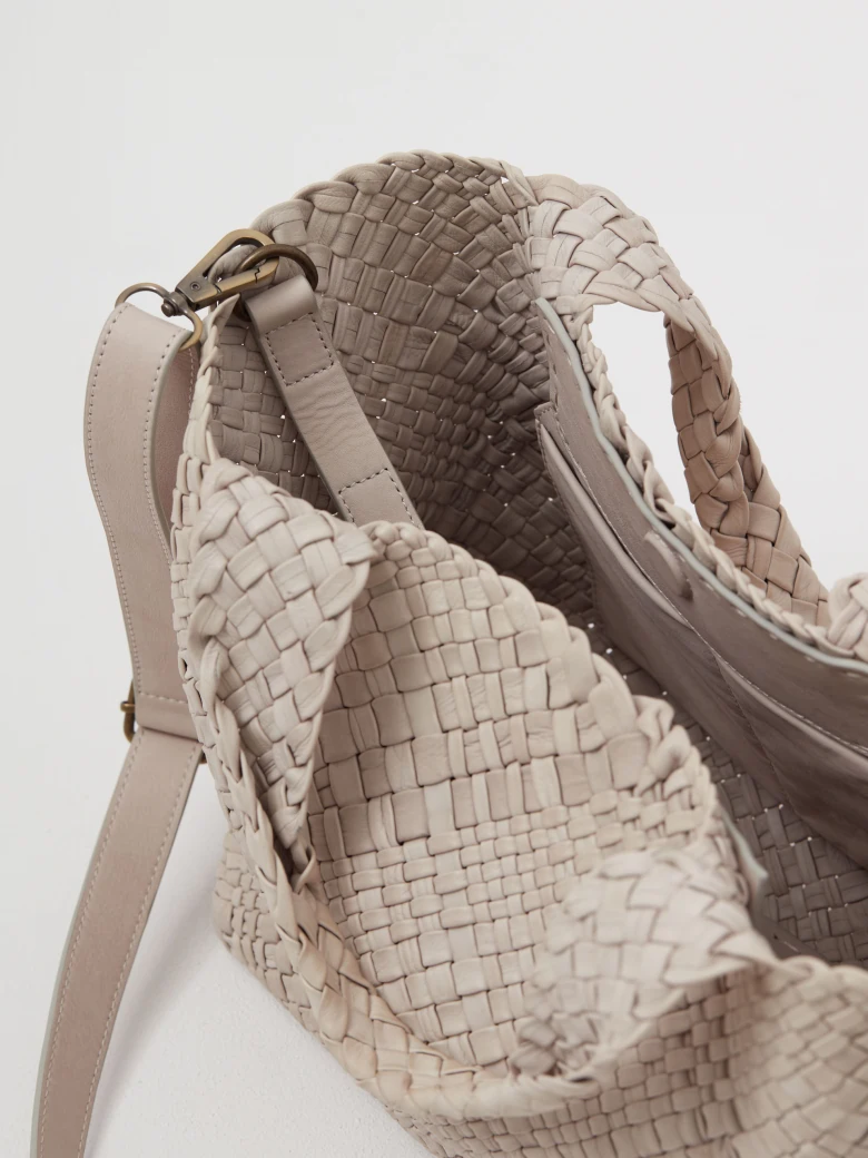 Creamy bag made of woven natural leather