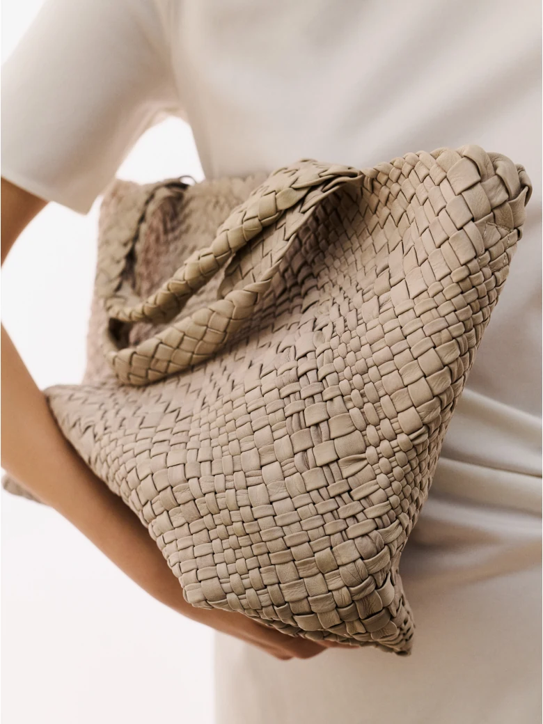 Creamy bag made of woven natural leather