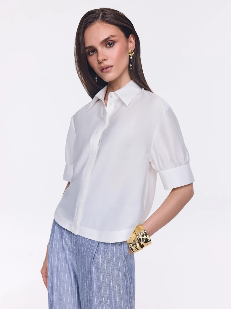An elegant white short-sleeved shirt
