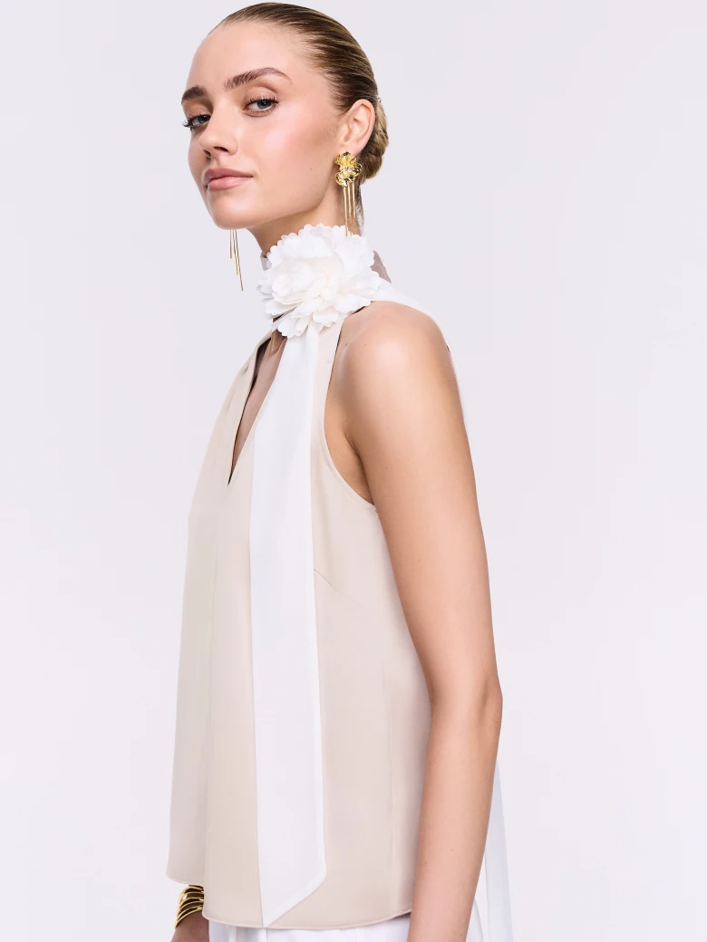 A satin blouse in a powder pink shade