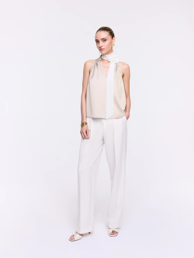 A satin blouse in a powder pink shade
