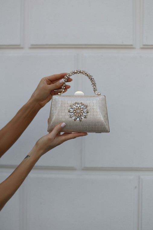 Handbag in gold color with jewelry embellishment