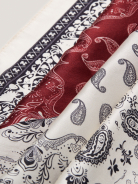A silk scarf with a paisley pattern