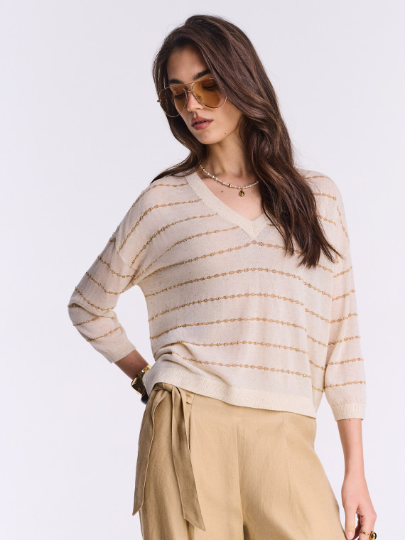 Light sweater with metallic embellishment