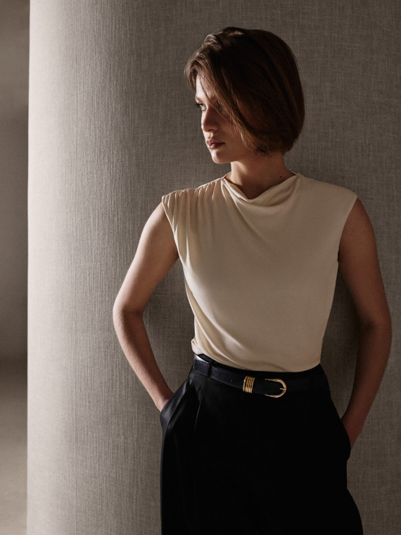A cream-coloured viscose blouse with ruffles