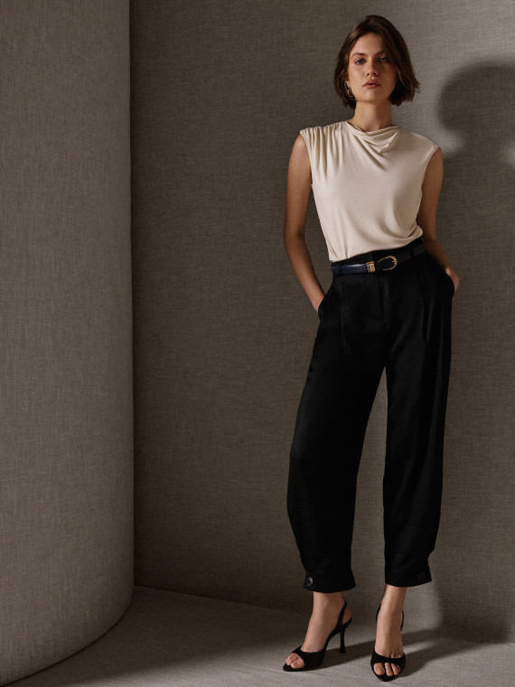 A cream-coloured viscose blouse with ruffles