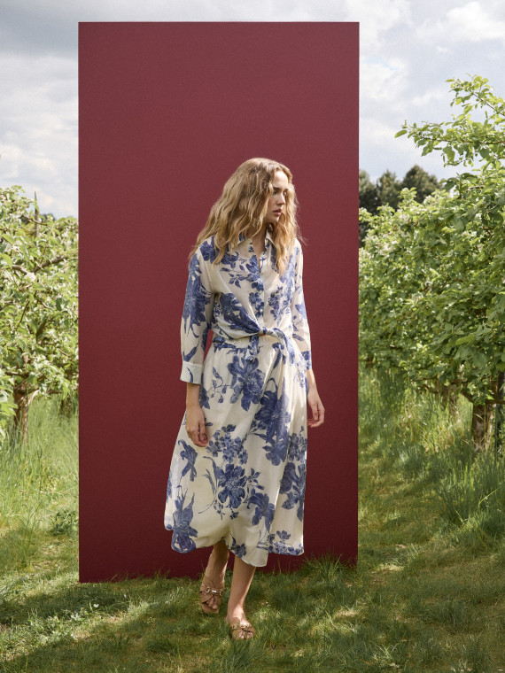 A cream-coloured, high-waisted skirt with navy blue floral print