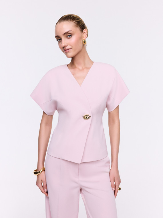 An elegant jacket with a decorative fastening
